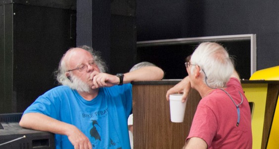 Steve Bristow chats with Mike Albaugh next to Atari Pong #47.